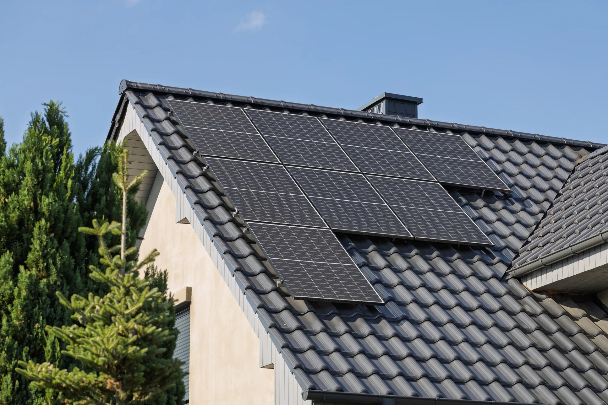 Texture detail of photoelectric cells of a solar panel and a industrial photovoltaic system installed on the roof of a shed